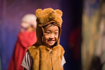 Preschool age kid in a theater play.
